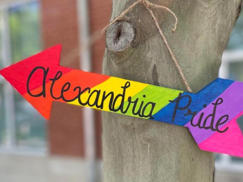 Alexandria Pride on rainbow colored arrow