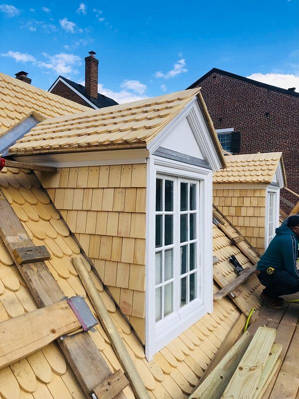 Nailing shingles on the roof