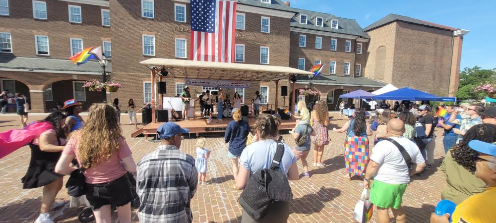 Band on stage performing during pride fair