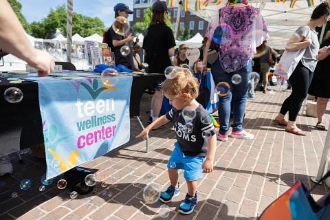 Teen Wellness Center table at pride fair