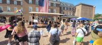 Band on stage performing during pride fair