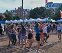 People dancing at pride fair