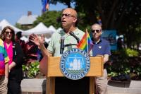 Mayor Justin Wilson speaking at a podium