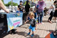 Teen Wellness Center table at pride fair