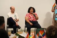 Two people speaking on panel