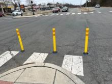 Image of yellow flexposts installed at pedestrian median