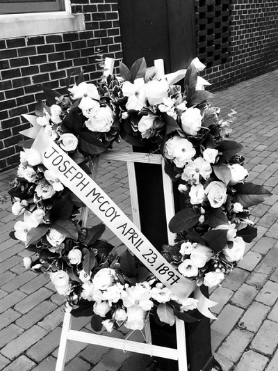 Wreath in memory of Joseph McCoy, lynched in 1897