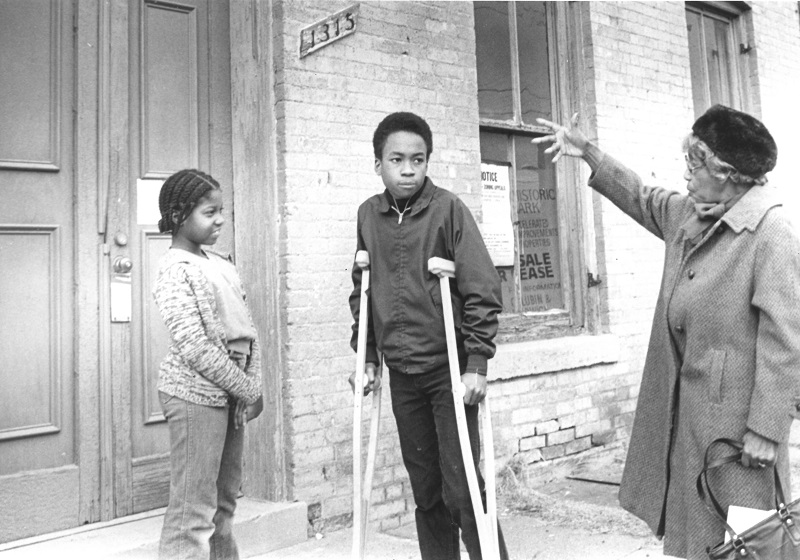 Annie B. Rose at 1315 Duke Street, with two unidentified children (1970s)