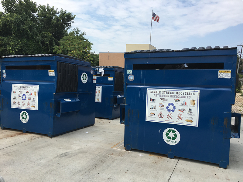 Photo of two large recycling bins at one of Alexandria's recycling drop of centers
