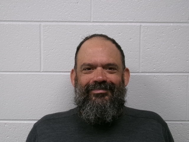 booking photo of a man with a white background