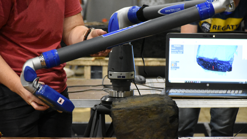 Archaeologists scanning wood from excavation of ships