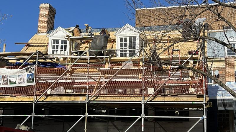 Installing the wood shingles on the oldest section of the house