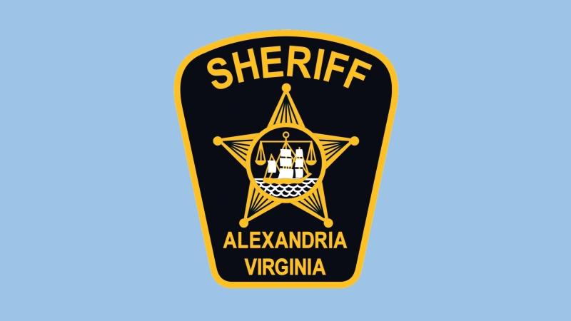 blue and gold shoulde patch with Alexandria seal of ship and scales in a five point star