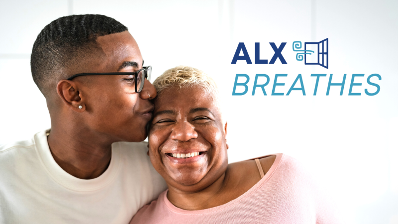 Black man kissing his mother on the forehead next to ALX Breathes logo