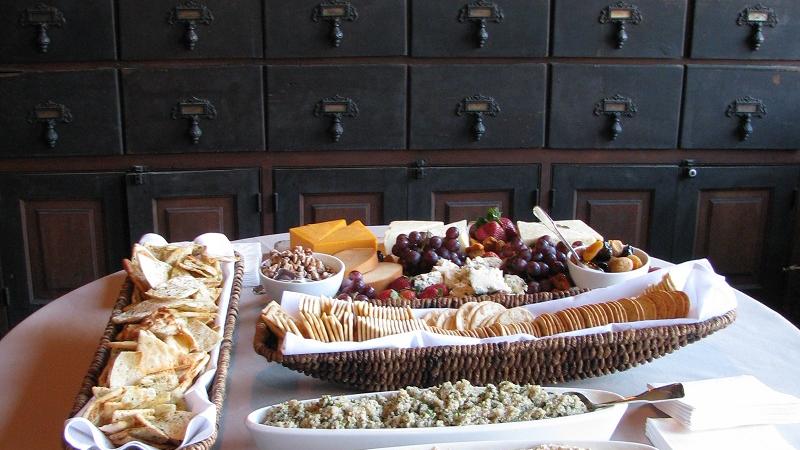 Snacks on a small table in the museum, with historic cabinets