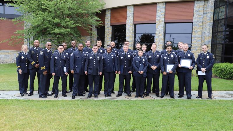 A Picture of APD Graduates with The Chif and training staff. 