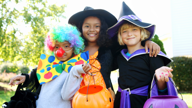 Three kids dressed in Halloween costume for Family October Fest