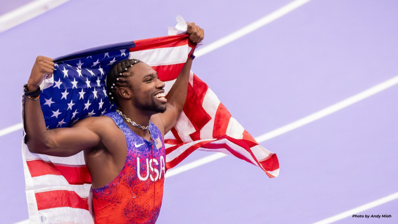 Noah Lyles Holding American Flag