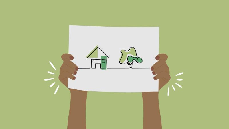 hands holding a paper with the healthy homes logo