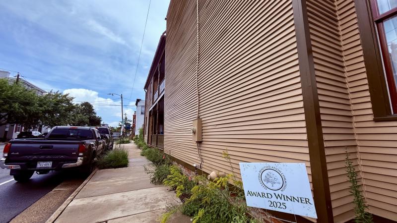 Image of a side of the house with the sign Award Winner 2025