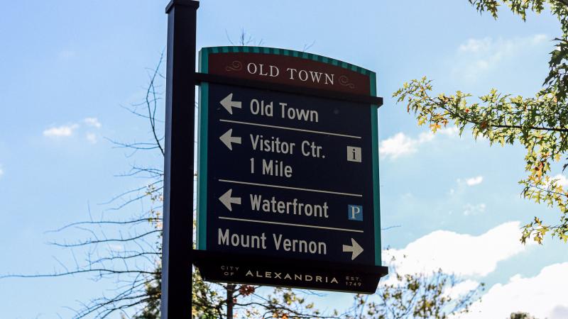 Image of a street sign that says Old Town on the top, then arrows pointing to the left with the words Old Town, Visitor Ctr, Waterfront, and another arrow pointing to the right with the words Mount Vernon