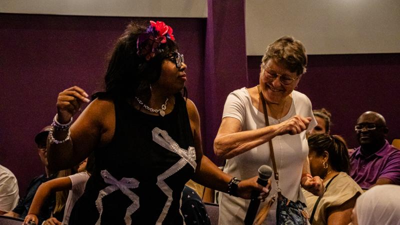 Two women are dancing 