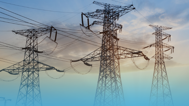 picture of three large power towers with a light blue gradient at the bottom