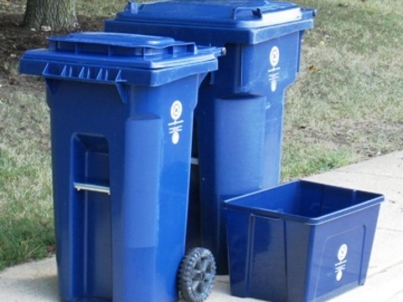 Photo of three blue recycling carts used in Alexandria