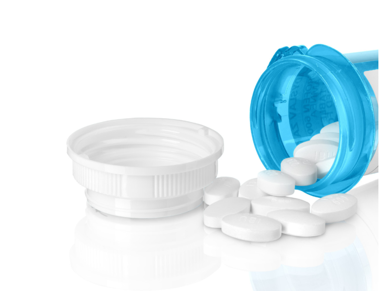 Blue medication bottle that is open with white pills