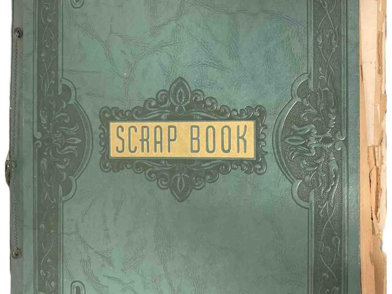The embossed green cover is labeled SCRAP BOOK in green on gold.
