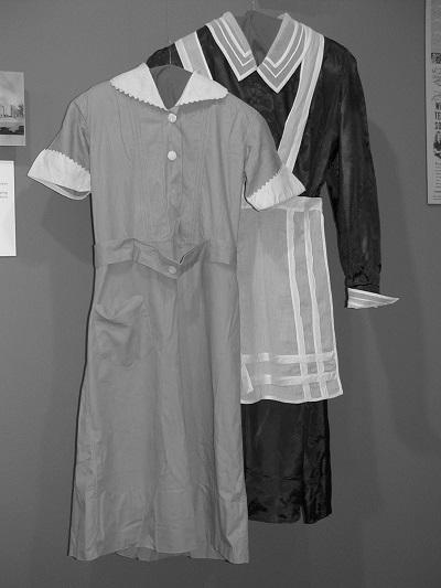 Maids uniforms, 1850s. Grey cotton for daily use and black dress uniform