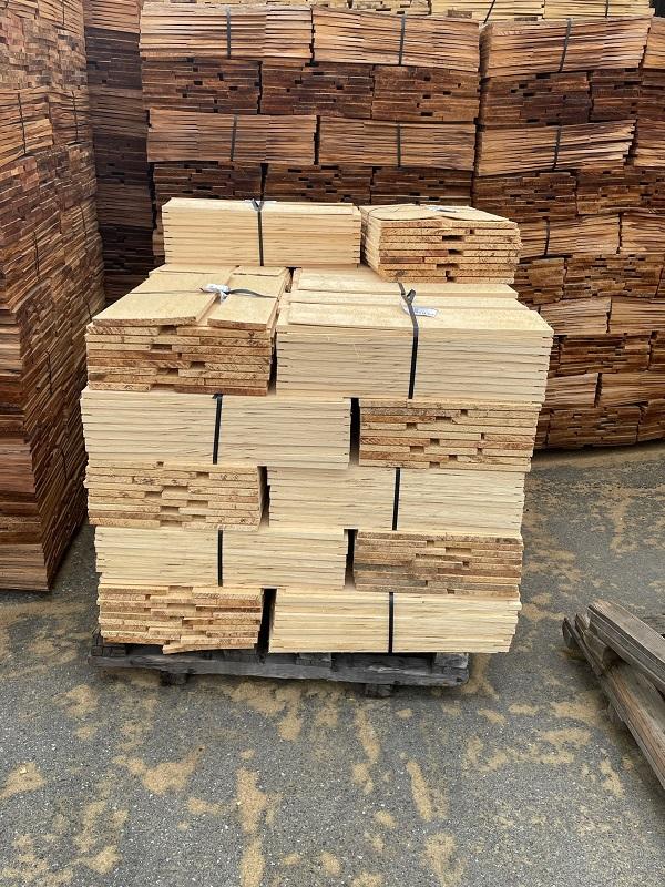 Pallets of Nootka cypress for the shingles