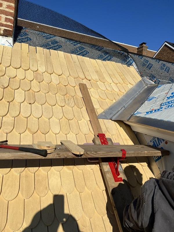 New shingles being placed on the roof