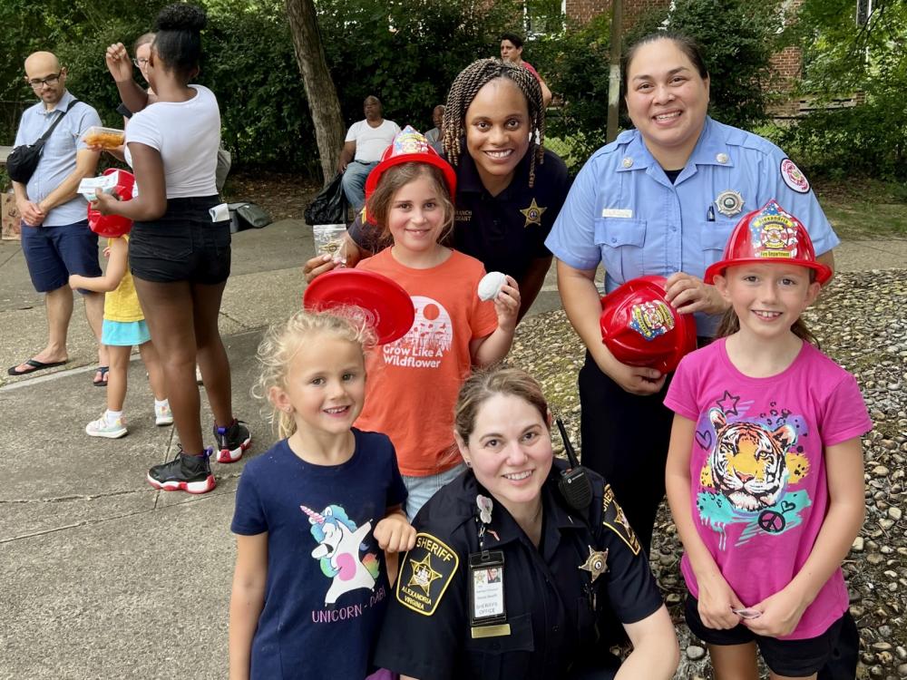 Two deputies, one firefighter and three kids -- all female -- at a National Night Out event in Lyhaven