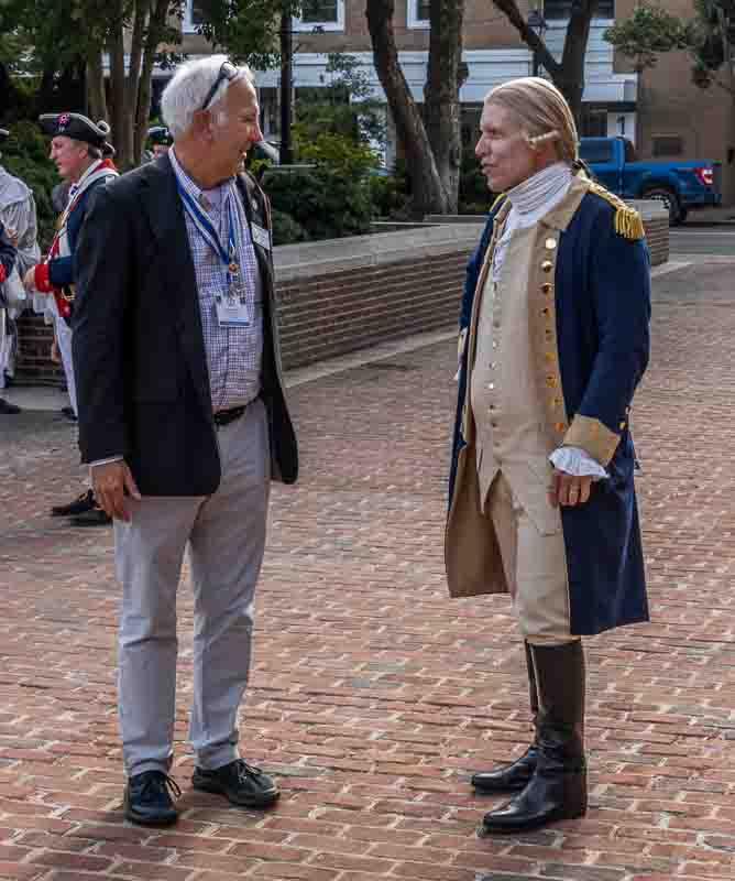 Two men on Market Square, one in Colonial attire