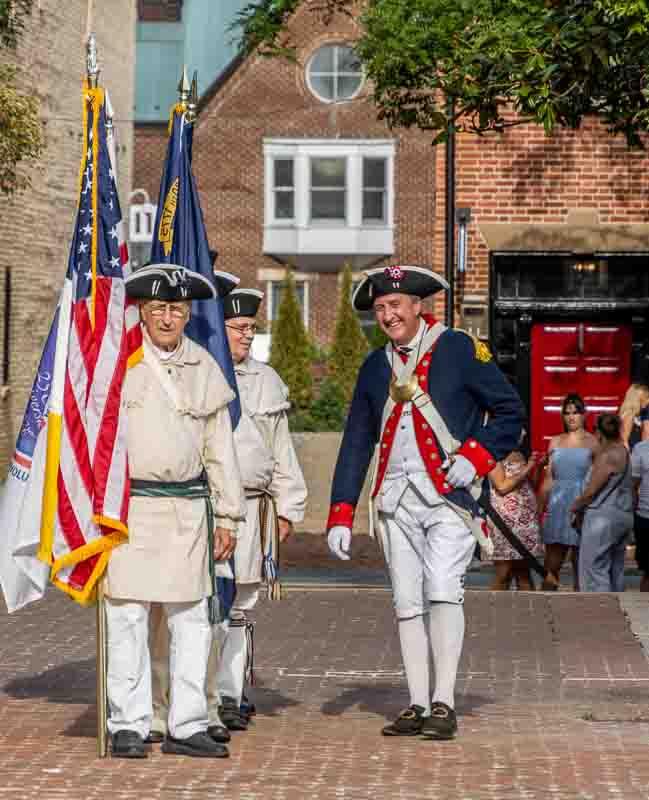 Colonial reenactors with flag