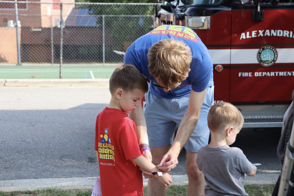 Tons of Trucks participants dad with two boys