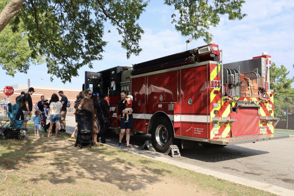 Tons of Trucks attendees checking out the fire truck