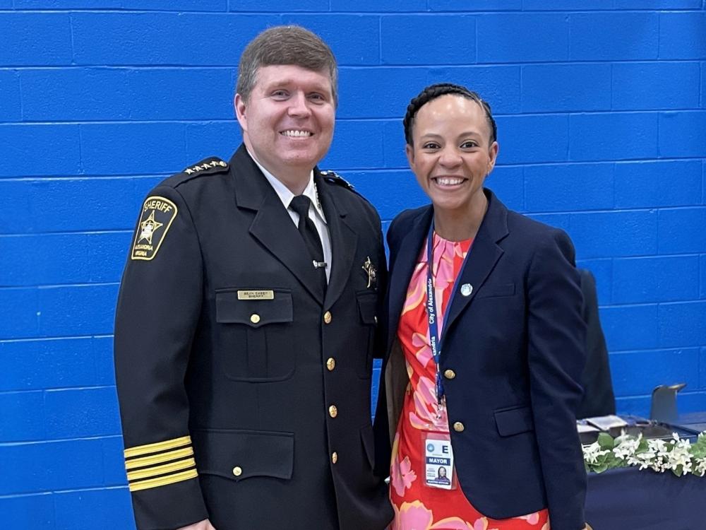 Sheriff in formal uniform and Mayor in civilian clothing, both smiling