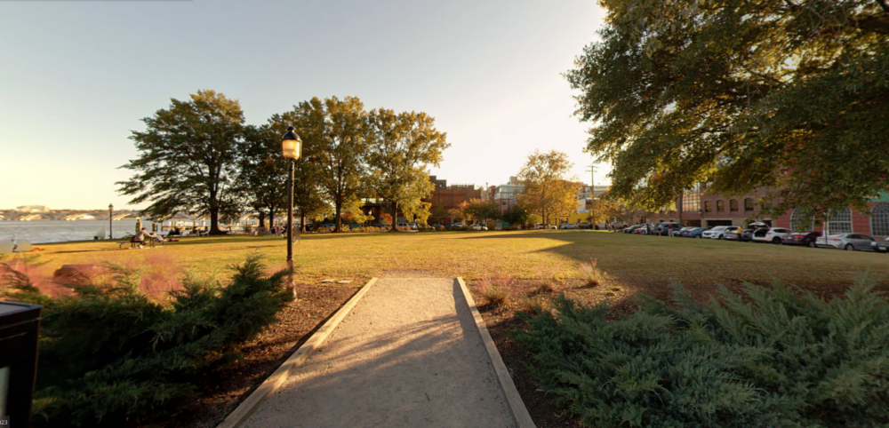Street-level view of Waterfront Park lawn from King Street Park.