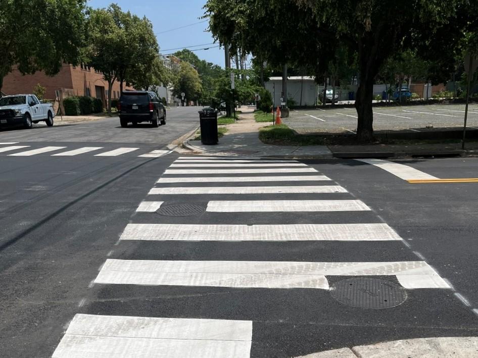 When the underground work is complete, the roadway is restored with new asphalt and striping for vehicular and pedestrian safety.