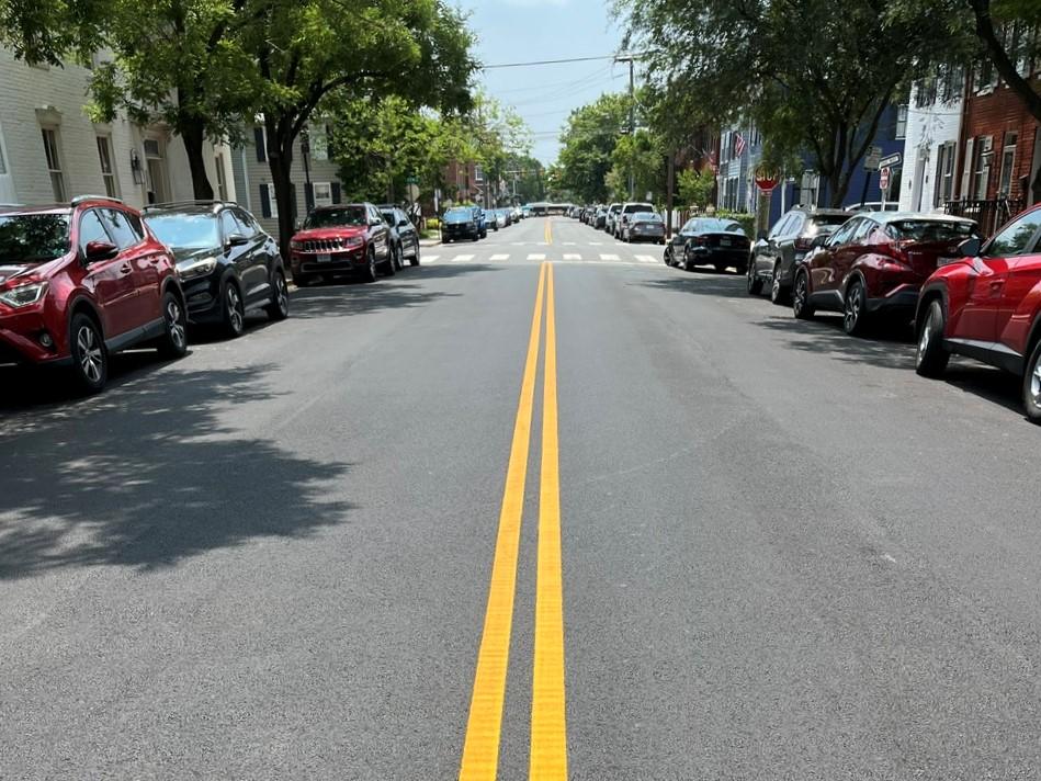 When the underground work is complete, the roadway is restored with new asphalt and striping for vehicular and pedestrian safety.