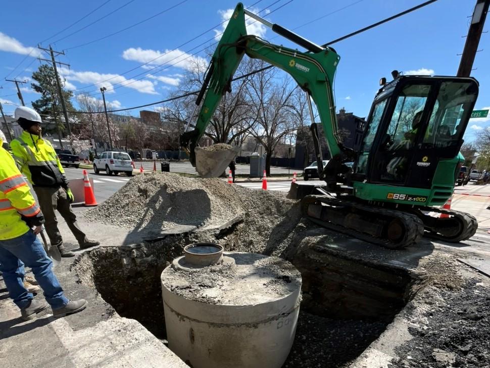 A new manhole is installed at the intersection of N Alfred St & Princess St