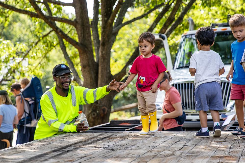A child playing on top of a truck
