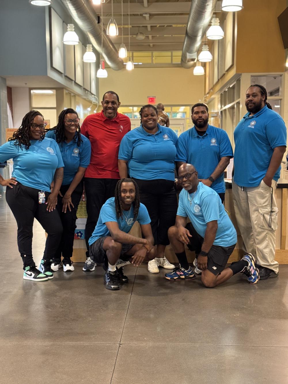 Charles Houston Rec Center staff all wearing the blue RPCA shirts except for one person wearing red
