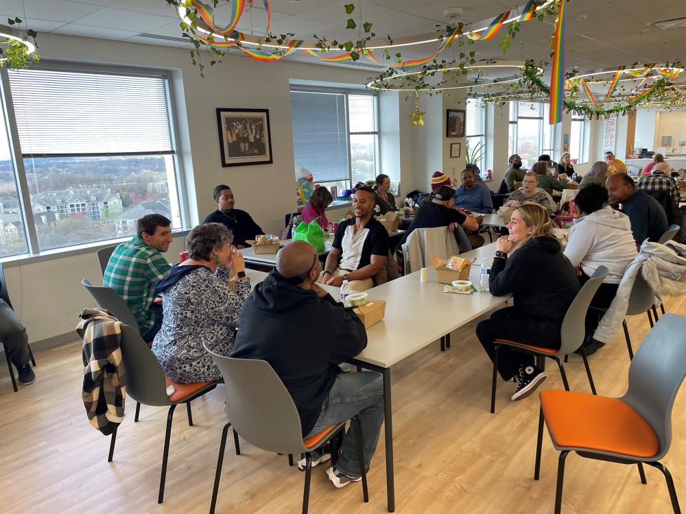 People eating casual lunch together in large room