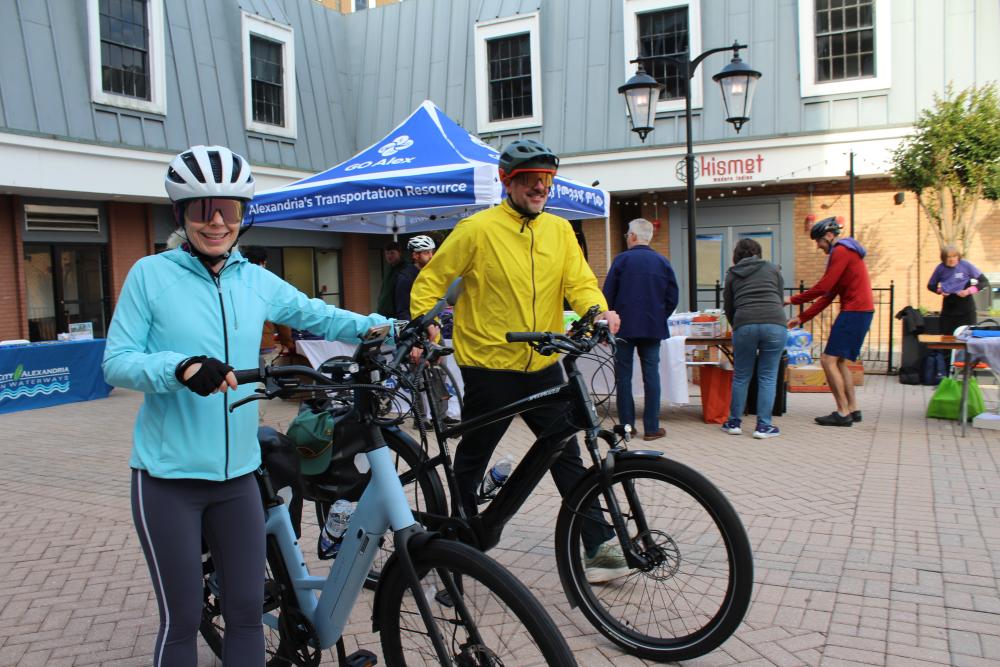 Participants riding through the vendor tables at the Old Town Pitstop