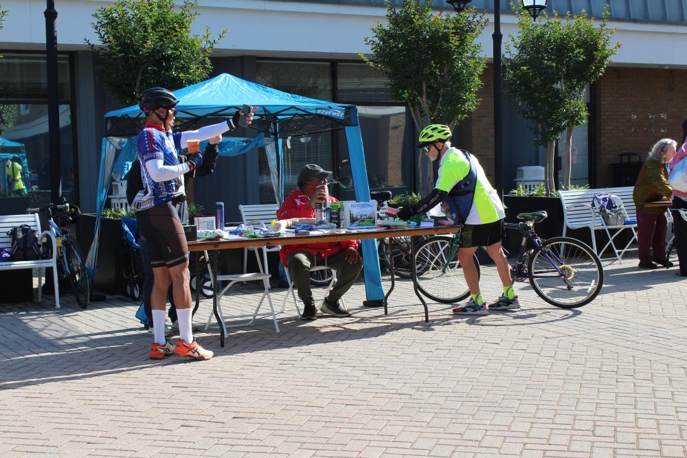 Participants engaging with vendors at the Old Town Pitstop 