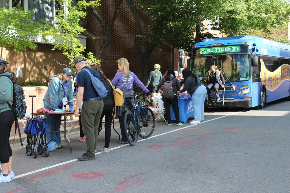 Participants engaging with City Partner tables at the Old Town Pitstop