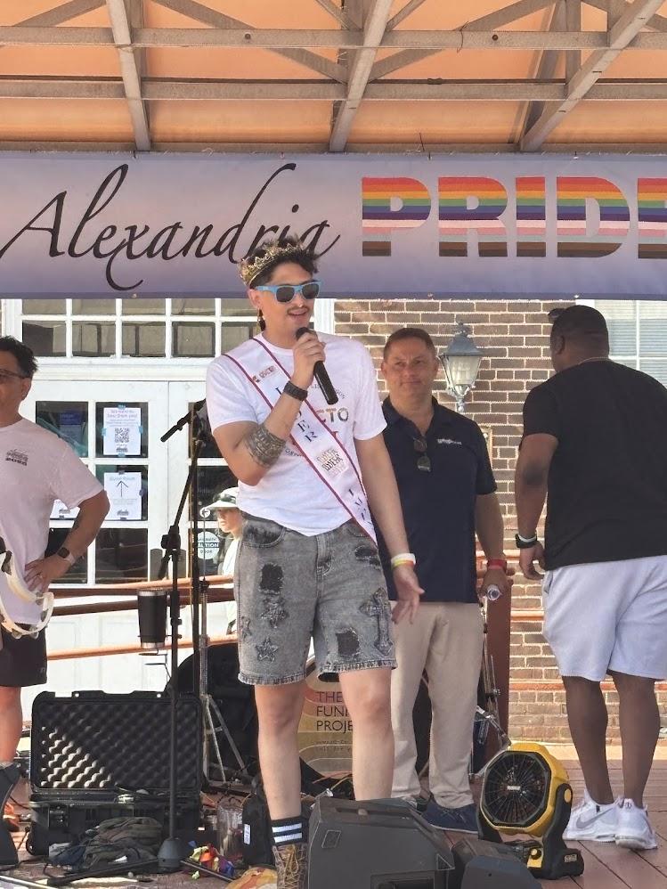 Speaker on stage at Alexandria Pride 2025